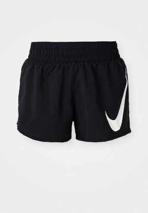Shorts de sport noirs avec une taille élastique, présentant un grand logo Nike blanc à l'avant et fabriqués dans un tissu lisse et léger.