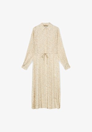 Beige pitkähihaista midimekkoa, jossa on hillitty kukkakuosi, kauluksellinen pääntie, etuhelmassa napit ja vyötäröllä nyöritys.