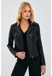 Black leather motorcycle jacket with a fitted design, notched collar, zippered pockets, and smooth texture. Tailored to mid-length.