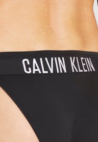 Calvin Klein Swimwear INTENSE POWER CHEEKY SIDE TIE - Cuecas de biquíni - black
