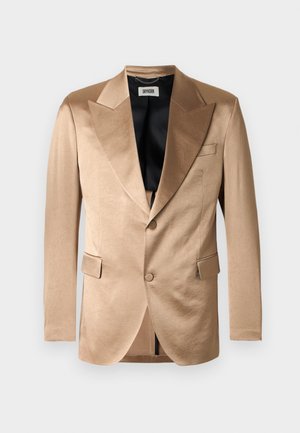 Beige satiinitakki terävällä kauluksella, kahdella etutaskulla, yhdellä napilla suljettava ja musta sisävuori. Sileä koostumus.