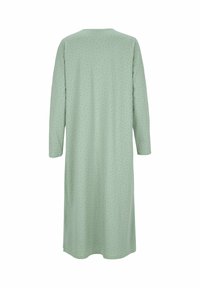 Långärmad klänning i ljusgrön tyg med spridda små svarta prickar, med rund halsringning och en lös passform som når under knäna.