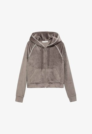 Grijze cropped hoodie gemaakt van zacht, pluizig materiaal. Beschikt over een voorrits, twee zijzakken en witte piping langs de naden.