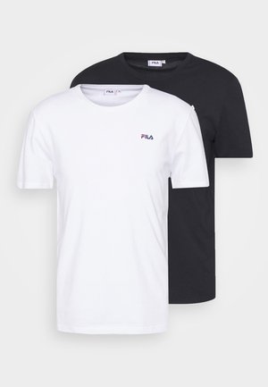 Two short-sleeve t-shirts, one white and one black, made from cotton. Each features a small embroidered FILA logo on the chest.