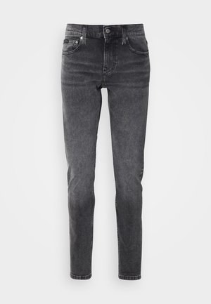Black denim jeans with a slim fit, featuring a high waist, classic five-pocket design, and subtle fading for a slightly worn texture.