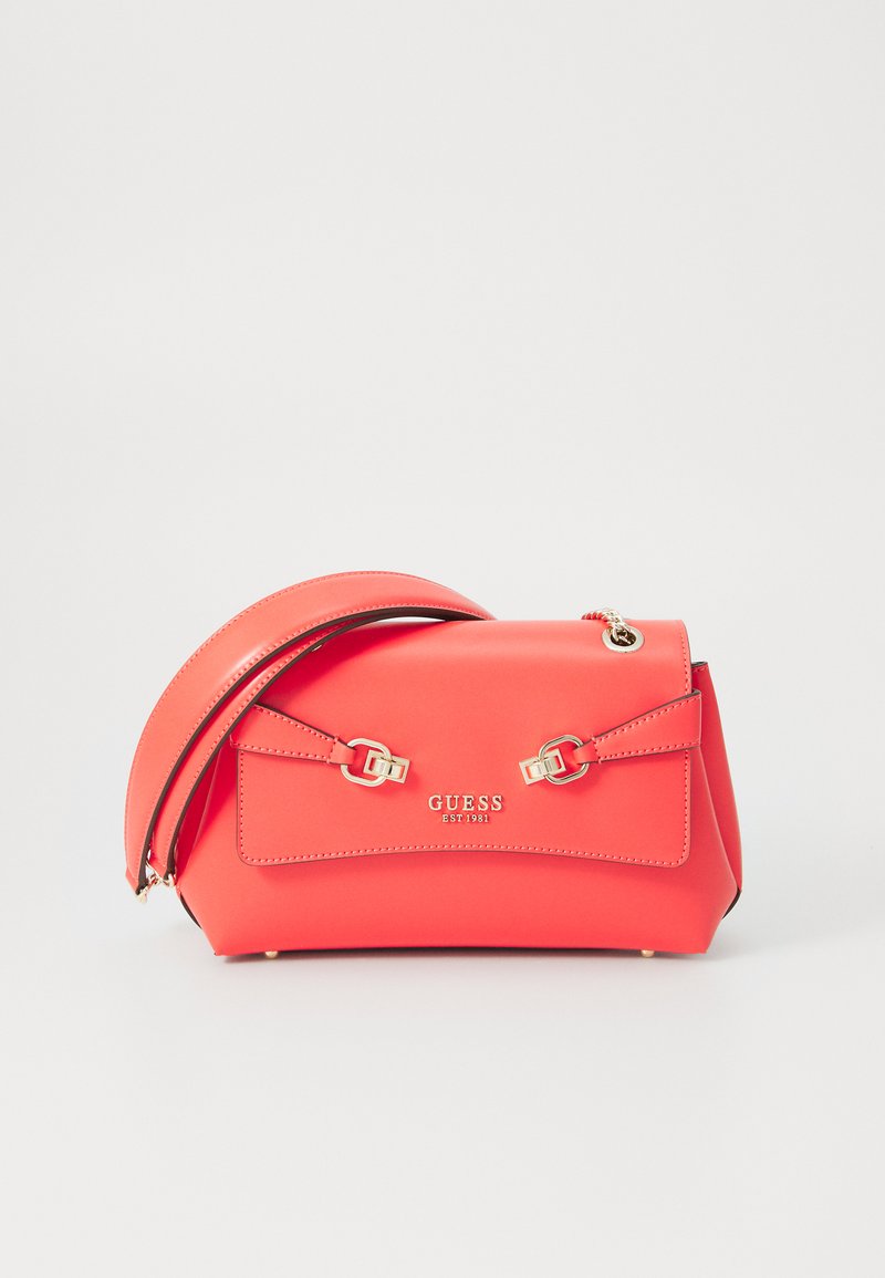 Red synthetic handbag with gold-tone hardware, dual straps, and adjustable shoulder strap. Features a flat front pocket and embossed logo.