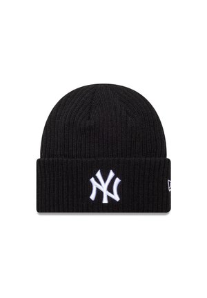 Sort strikket beanie-hue med ribbet tekstur og opfoldet kant, som har et hvidt broderet New York Yankees-logo foran.