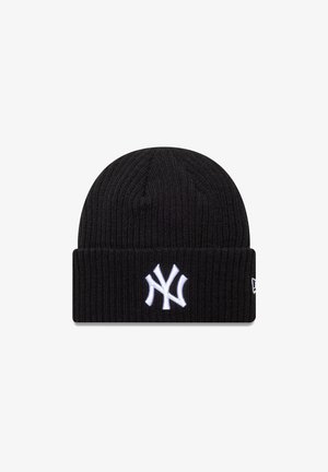 Cappello beanie nero lavorato a maglia con texture a costine e bordo piegato, caratterizzato dal logo ricamato bianco dei New York Yankees sul davanti.