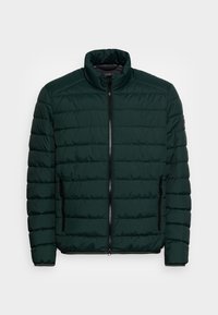 Mörkgrön vadderad jacka med hög krage, blixtlåsförsedd fram och sidofickor. Har en quiltad design med horisontella sömmar.