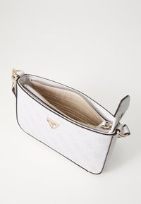 White textured handbag with a zip closure, gold-tone hardware, and a triangular logo accent. Features multiple interior compartments.