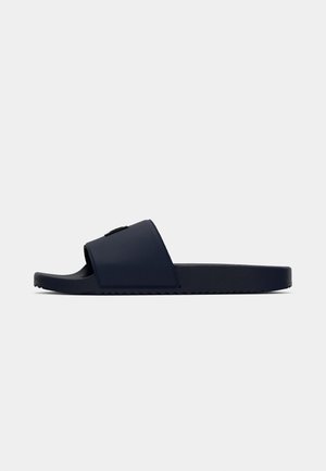 Navy blue slide sandal with a textured rubber sole, a wide strap covering the top, and a smooth finish. No visible markings or logos.