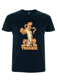 Svart bomullströja med en grafisk bild av Tigger i orange och krämfärg, med fet "TIGGER"-text i matchande orange färg. Avslappnad passform.