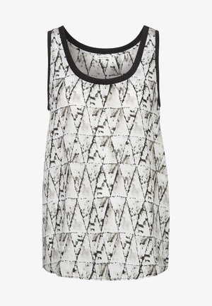 Halenka bez rukávů s geometrickým černo-bílým vzorem trojúhelníků, vyrobená z lehké tkaniny s černým lemem.