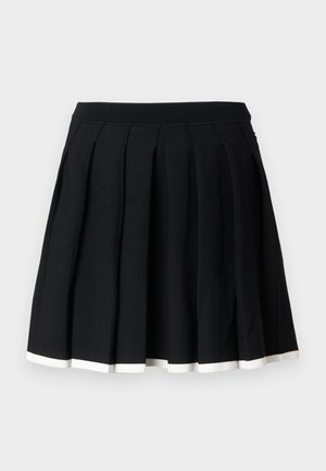 Gonna plissettata nera con una vita elasticizzata, caratterizzata da un orlo bianco nella parte inferiore. Realizzata in un tessuto morbido e liscio.