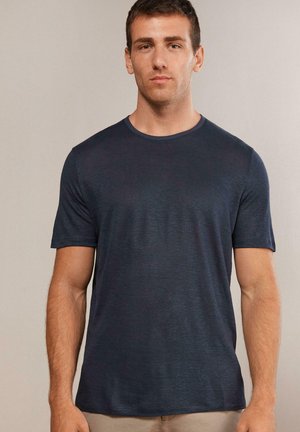 Marineblaue, kurzhälstige T-Shirt aus weichem, strukturiertem Stoff mit Rundhalsausschnitt. Bietet einen schmalen Schnitt und ein minimales Design.