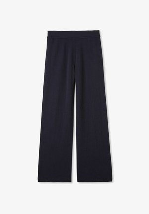 Sorte bukser med vide ben og elastisk talje, lavet af blødt, strikket stof, vist fladt på en hvid baggrund.