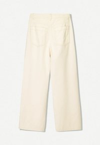 Wide-leg pants in off-white fabric with a smooth texture. Features two back pockets with stitched detailing, no visible hardware.