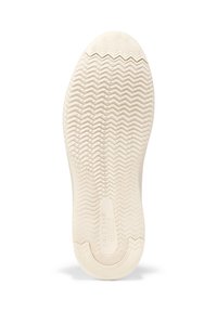 Vitt gummisula med ett texturerat zigzag-mönster, cirkelmässig designelement nära hälen och en prägling av logotypen i mitten.