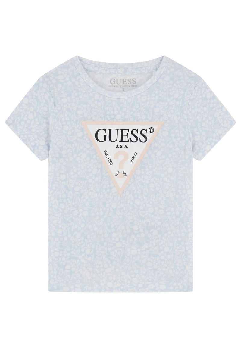 T-shirt bleu clair à manches courtes en coton bio. Présente un logo triangulaire noir et beige au centre avec un motif floral.