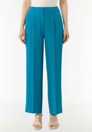 Teal wide-leg trousers with a high waist, front pleats, and a small logo detail. Smooth fabric with a tailored design.