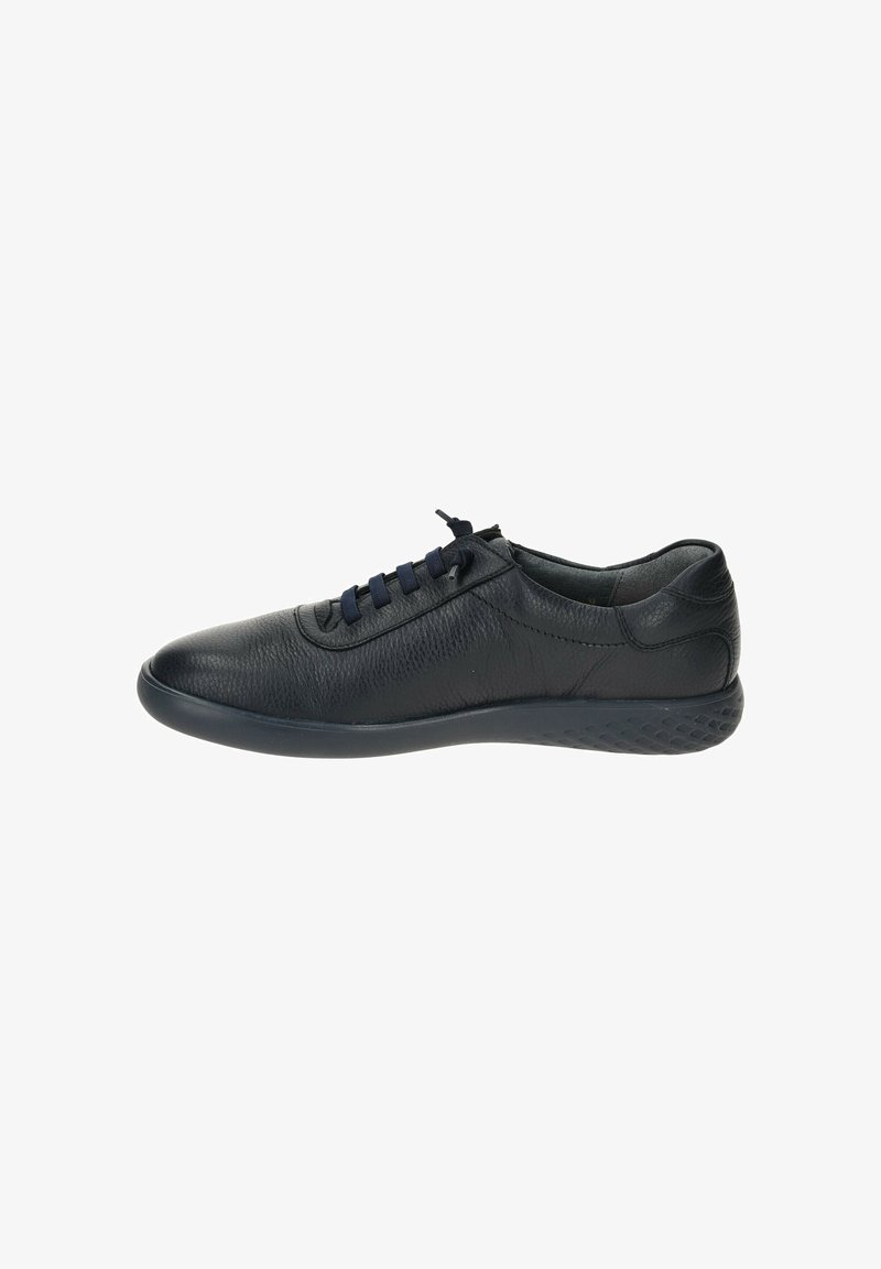 Black leather sneaker with rounded toe, textured upper, and navy laces. Features a flexible rubber sole with a patterned grip design.