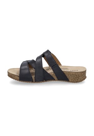 Black leather slide sandal with crisscross straps, brown cushioned footbed, and lightweight textured cork sole. Designed for comfort.