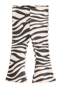 Sorte og cremefarvede zebra-mønstrede leggings med vidde, ribbet tekstur og flæsekanter nederst, med en tætsiddende taljebånd.