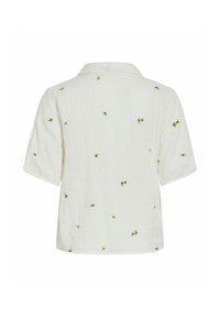Chemise blanche à manches courtes avec une coupe décontractée, col et petites broderies dispersées de fleurs jaunes dans le dos.