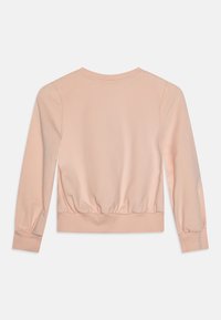 Rosa bomullssweatshirt med lange ermer, rund halslinning og rynket nederkant. Jevn tekstur med ribbestrikkede mansjetter og midjebånd.