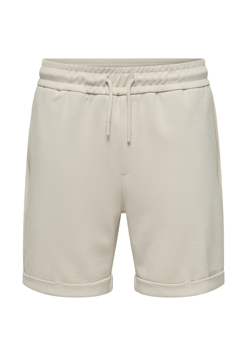 Pantalones cortos de algodón beige, con una cintura elástica y cordones, bolsillos laterales y bordes doblados. Tela suave y texturizada.