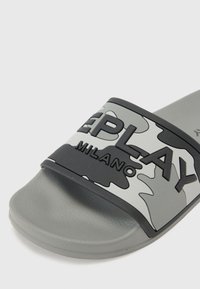 Gray slide sandals with a camouflage-patterned strap featuring embossed 'REPLAY MILANO' text, made from flexible material, soft footbed.