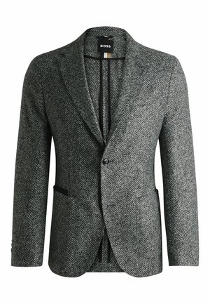 Blazer grigio a motivo herringbone con rever a punta, chiusura con un solo bottone e tasche. Tessuto testurizzato con foderatura liscia. Etichetta del marchio visibile all'interno.