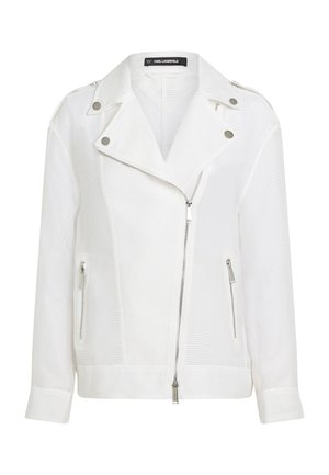 Veste blanche texturée avec fermeture éclair, fines rayures horizontales, ferrures argentées et col cranté. Comprend des poches latérales zippées.