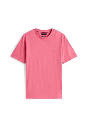 Miesten lyhythihainen pyöreäkauluksinen vaaleanpunainen T-paita, jossa pieni Tommy Hilfiger -logo vasemmassa rinnassa.