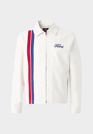 Veste blanche avec une fermeture éclair sur le devant, arborant des rayures verticales rouges et bleues sur le côté gauche et le logo "Ford" brodé en bleu.