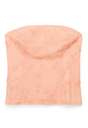 Trägerloses, pfirsichfarbenes Oberteil mit bestickten Blumenmustern und leicht strukturierter Brustpartie, dargestellt vor weißem Hintergrund.
