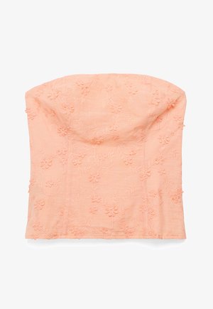 Trägerloses, pfirsichfarbenes Oberteil mit bestickten Blumenmustern und leicht strukturierter Brustpartie, dargestellt vor weißem Hintergrund.