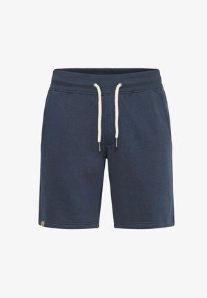 Tamsiai mėlynos šortai, pagaminti iš minkštos medžiagos, turi elastingą juosmenį su baltais raišteliais ir mažą logotipo akcentą šone.