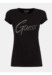 Černé bavlněné tričko s význačným logem "Guess" vyrobeným ze stříbrných kamínků. Krátké rukávy a klasický kulatý výstřih.