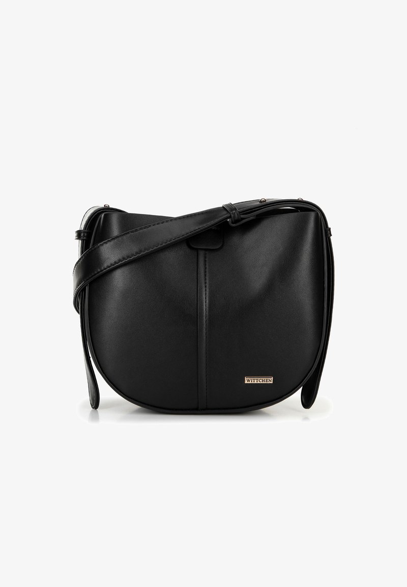 Black leather crossbody bag with a curved shape, featuring a front flap, long adjustable strap, and subtle gold logo accent.