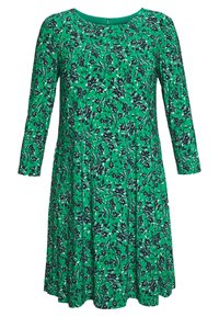 Green floral dress with long sleeves, round neck, and flared skirt. Features a black floral pattern on a vibrant green background.