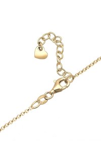 Collier chaîne ton or avec fermoir mousqueton, maillons d'extension, et un petit pendentif en forme de cœur au bout de la chaîne d'extension.