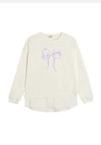 Sudadera de color crema con escote redondo y mangas largas, con un diseño de lazo brillante en el centro y un dobladillo en capas.
