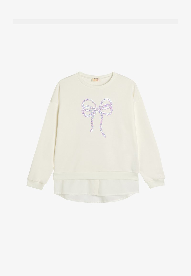 Kremowy sweatshirt z okrągłym dekoltem i długimi rękawami, z błyszczącym wzorem kokardy na środku i warstwowym dołem.