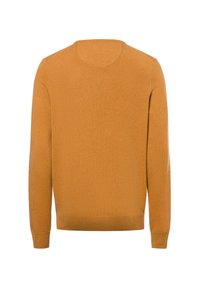 Senfgelber Rundhalsausschnitt-Pullover mit langen Ärmeln, aus weichem Strickstoff gefertigt, mit glatter Textur und gerippten Bündchen und Saum.