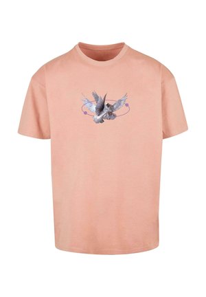 Short-sleeve, light peach cotton t-shirt featuring a gray and white bird graphic with intricate wings and circular accents in purple.