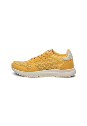 Yellow athletic shoe featuring a mesh design with hexagonal patterns, suede overlays, and a white rubber sole. Lace-up front and textured heel.