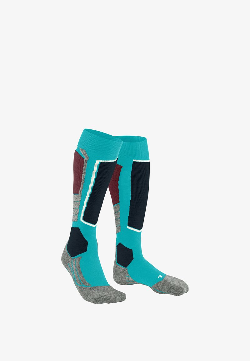 Chaussettes montantes en teal, gris, marine foncé et bordeaux, présentant des motifs géométriques et des panneaux de textures variées pour un confort accru.