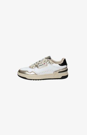 White and gold sneaker with black accents, featuring smooth leather, a round toe, lace-up design, and a textured rubber sole.