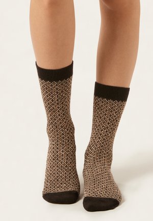 Knit socks featuring a textured brown and black pattern, with a ribbed black cuff and solid black toe and heel accents.